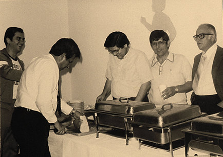 A picture from the late 60s or early 70s featuring a buffet with Anthony Kouzounis, Gus Demeris, Jimmy Demeris, Nick Demeris, George Vlahakos